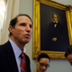 Sen. Ron Wyden, D-Ore., left, talks with reporters on Capitol Hill.